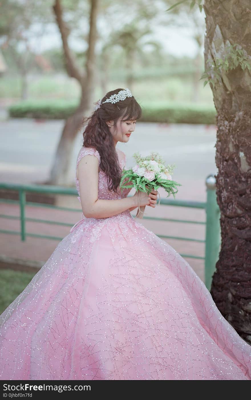 Woman in Pink Sleeveless Gown