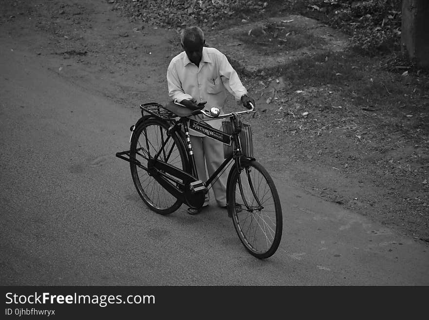 Man Beside Bicycle