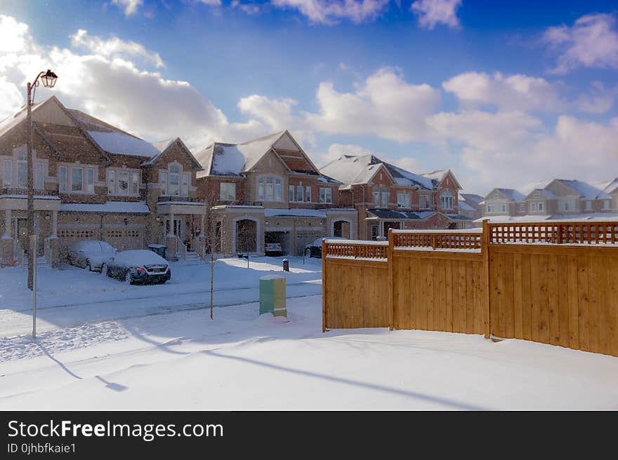 Brown 2-storey Houses during Snow