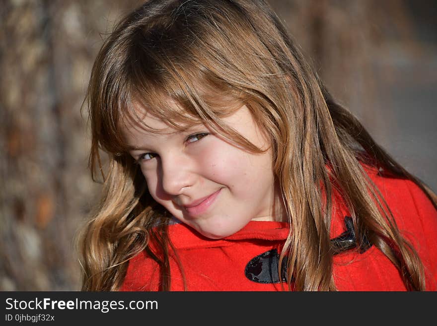 Blonde Girl Wearing Red Toggle Jacke