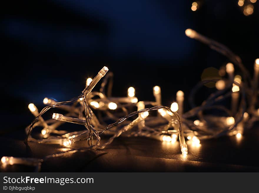 Selective Focus Photo of White and Yellow String Lights