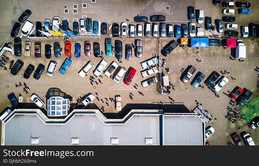 High-angle Photo of Vehicles Parked Near Building