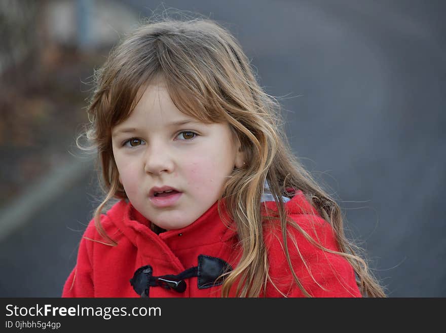 Blonde Girl Wearing Red Toggle Jacket