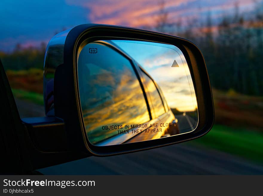 Selective Focus Photography of Vehicle Side Mirror