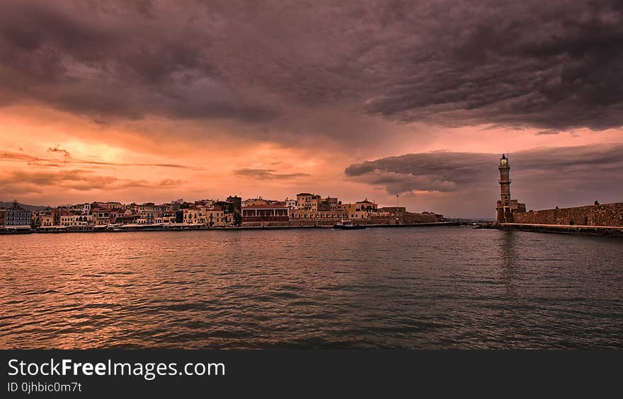 Photo Taken Near Body of Water With Golden Hour Background