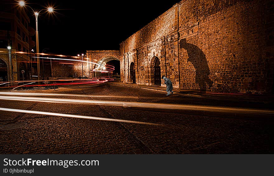 Brown Concrete Wall during Night Time Photo