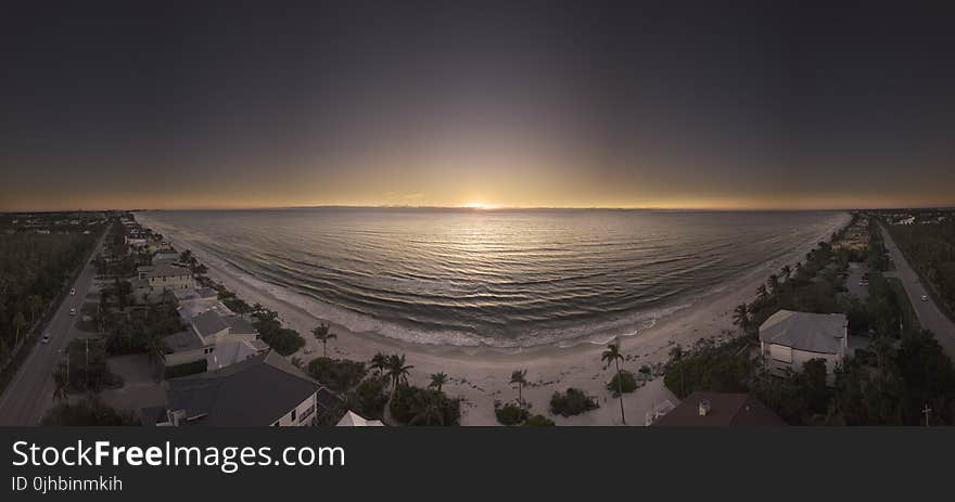 Panoramic Photography of Beach during Golden Hour