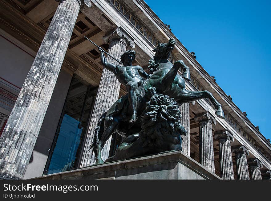 Man Riding Horse Statue