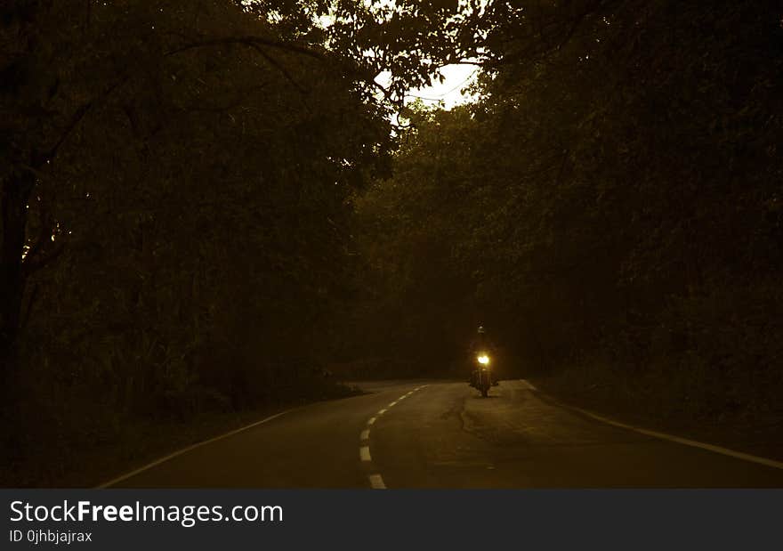 Man Riding a Motorcycle Photo