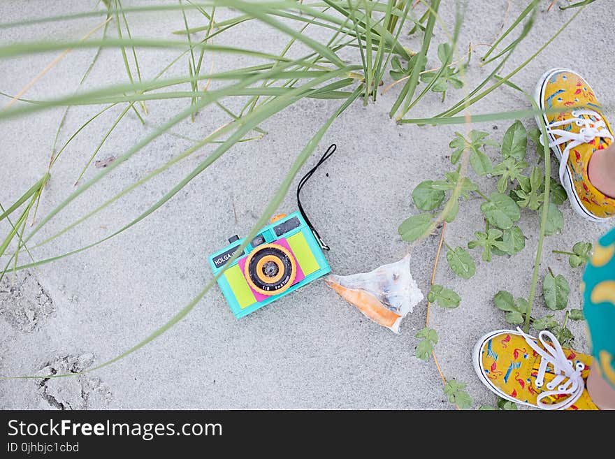 Multicolored Digital Camera With Pair Brown Shoes