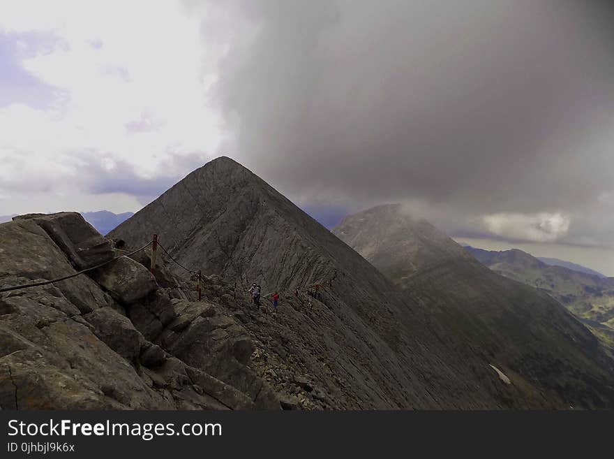 Mountain Range Under Grey Skies