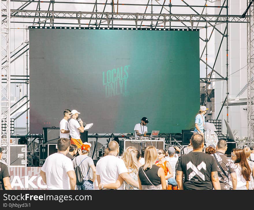 People Gathered in Front of Stage