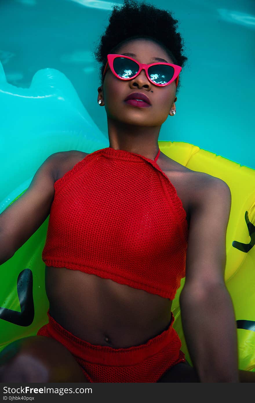 Woman Wearing Red Bikini on Float Talking Photo on Pool