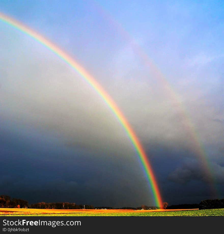 Photography of Rainbow During Cloudy Sky