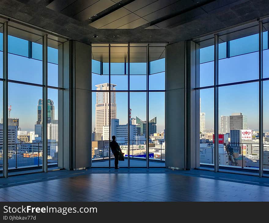 Person Inside Clear Glass Room