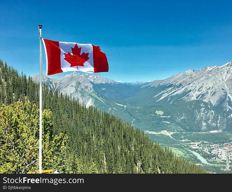 Canada Flag With Mountain Range View