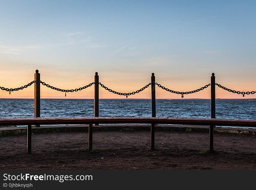 Four Metal Poles With Link Chains