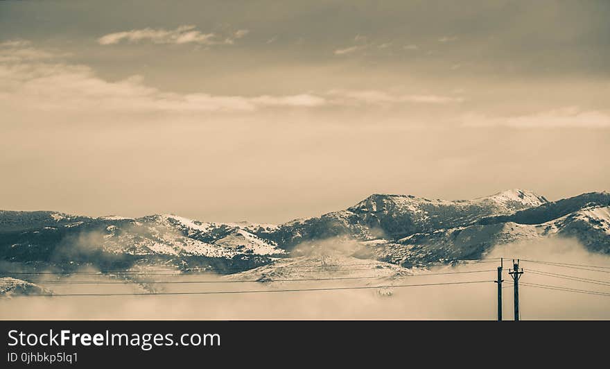 Cable Wires in Front of Snow Covered Mountains