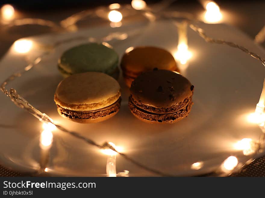 Four Assorted Macaroons on Plate