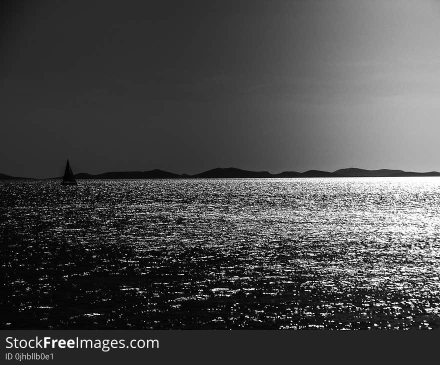 Grayscale Photo of a Body of Water