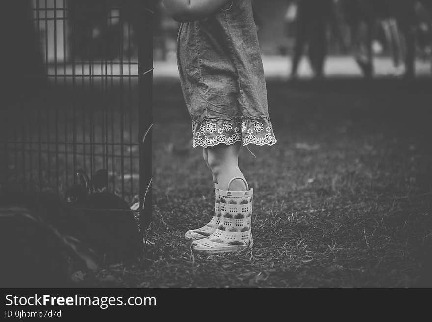 Monochrome Photography of Children Wearing Boots