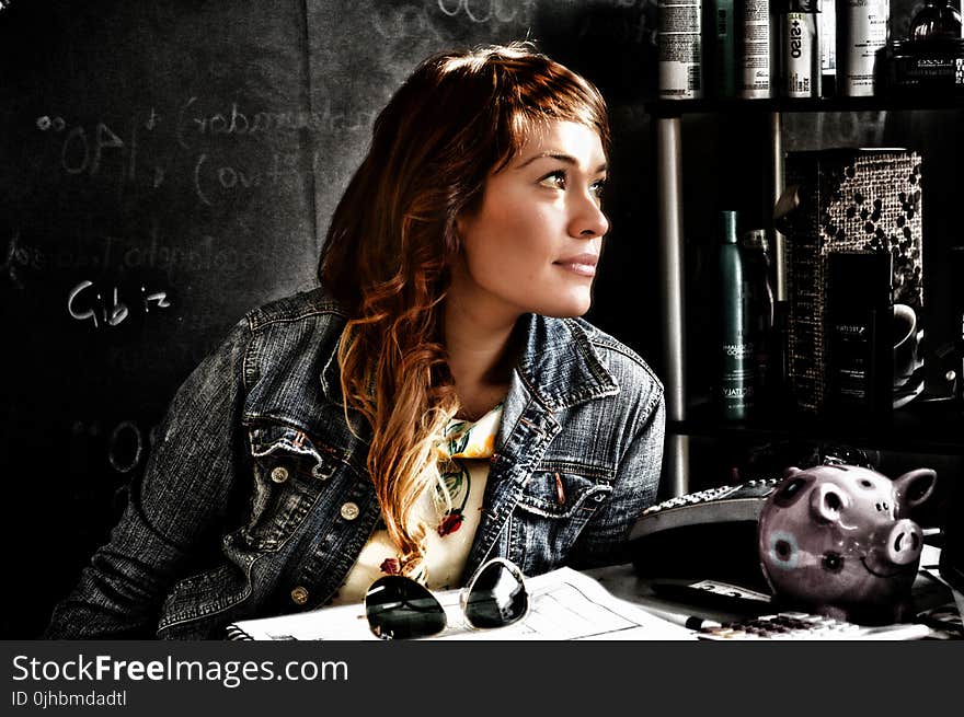 Close-up Photography of a Woman in Blue Denim Jacket