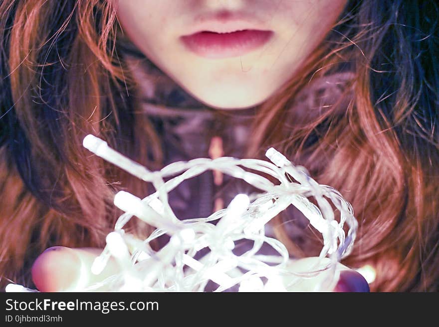 Woman Holding String Light