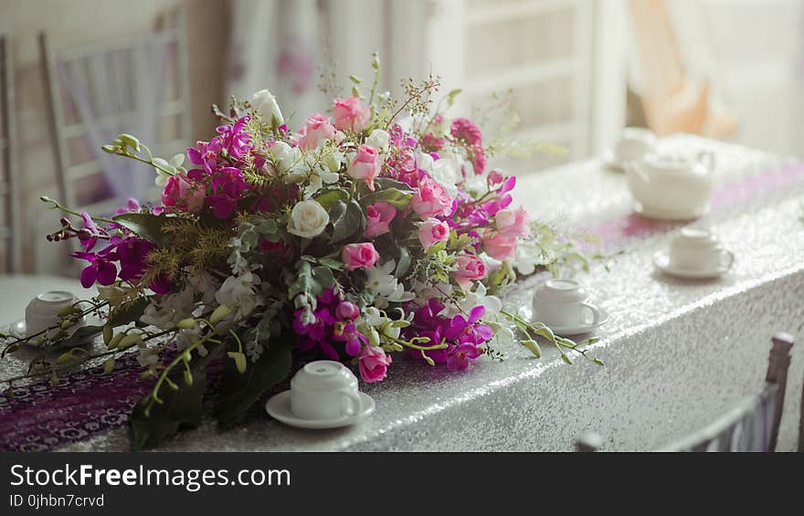 Photography of Flowers near Cups