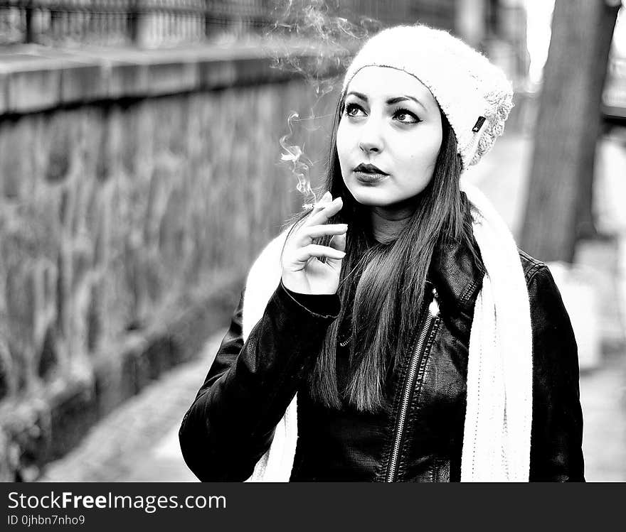 Grayscale Photography Of Woman Smoking