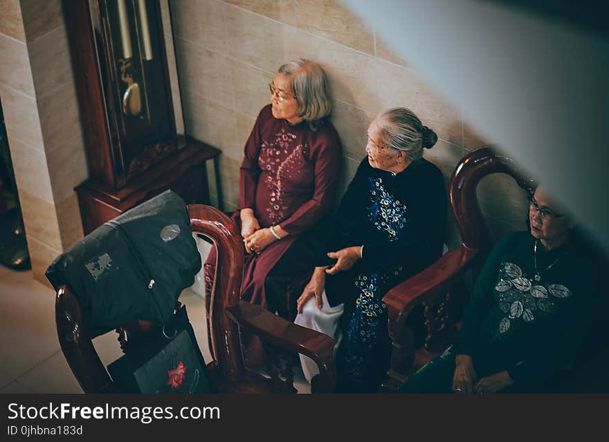 Photography of Three Old Women Sitting on Chair