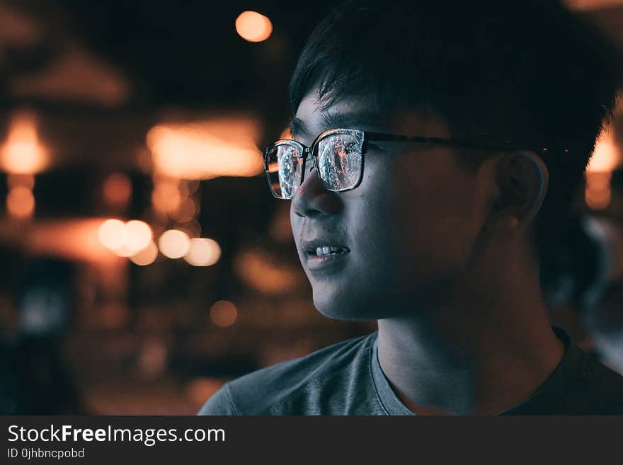 Man in Gray Shirt Wearing Eyeglasses