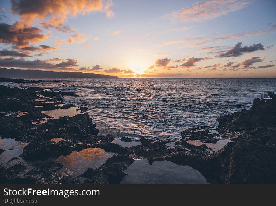 Scenic View of Ocean During Sunset