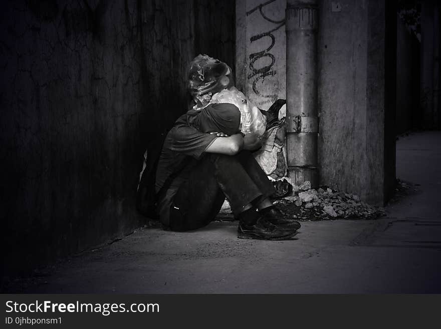 Monochrome Photo of a Homeless Man