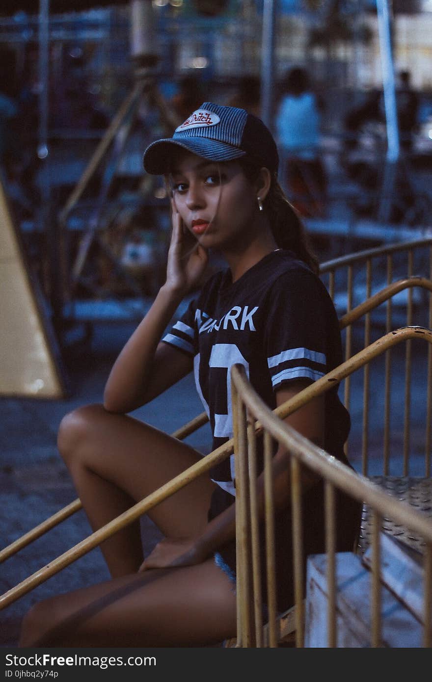 Woman in Black and White T-shirt and Von Dutch Cap