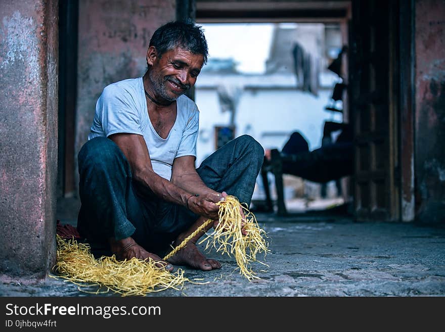 Man Holding Yellow String