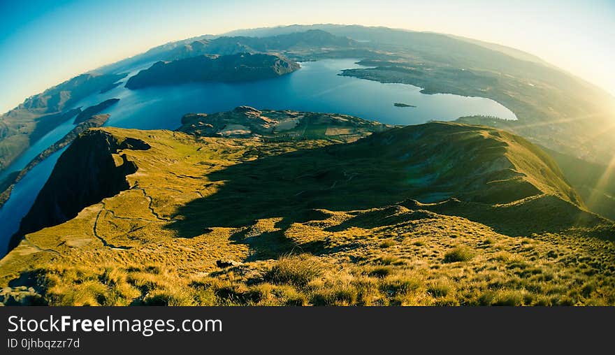 Aerial Photography of Mountain Near on Body of Water