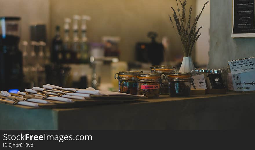 Four Assorted Air-tight Jars on Table