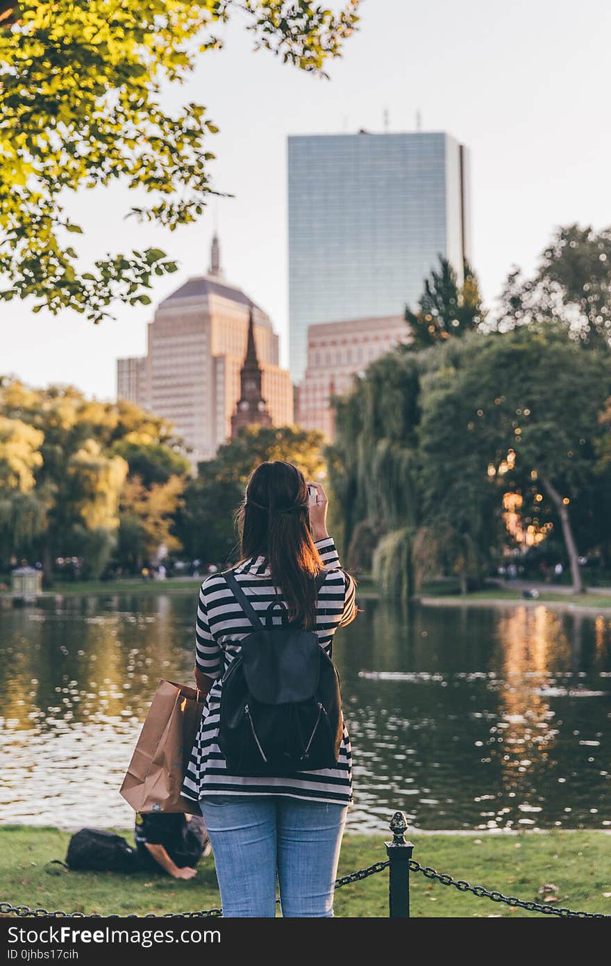 Photo of Woman Standing Near Body of Water