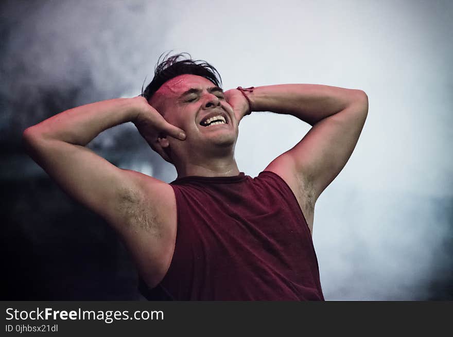 Man in Maroon Tank Top