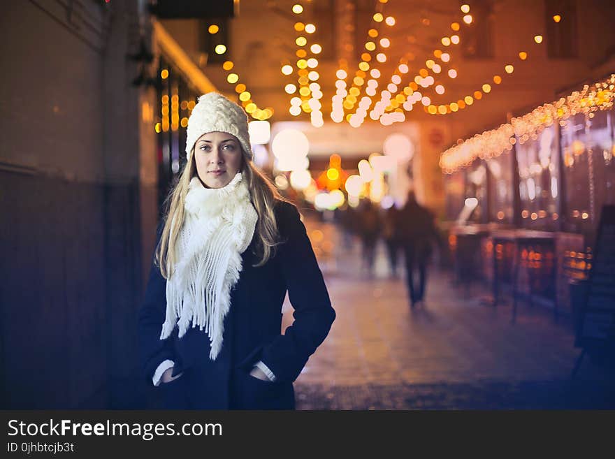 Woman In Black Long-sleeved Top With White Scarf