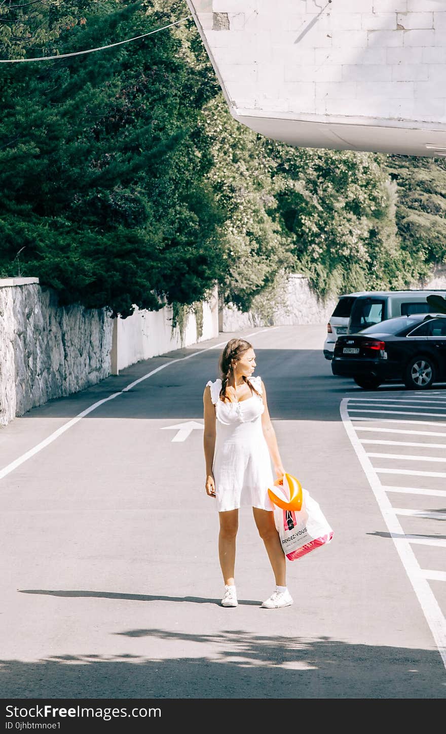 Woman Standing in the middle of the Road