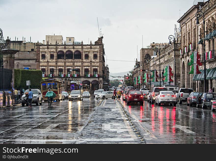 Cars and People on Rainy Day