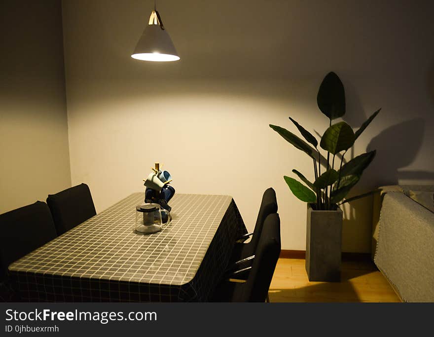 Photo of Dining Table near the Plant