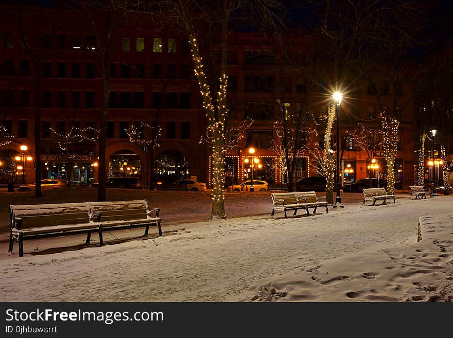 Photo of Snow Covered Benches in the Street