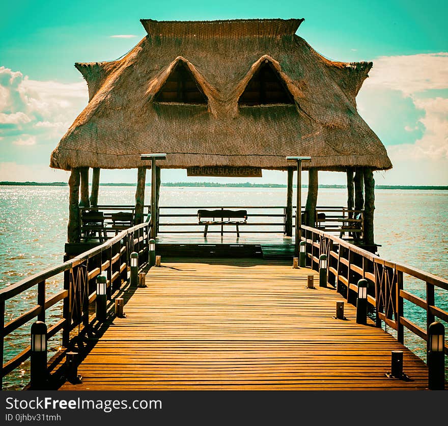 Brown Wooden Hut On Pier