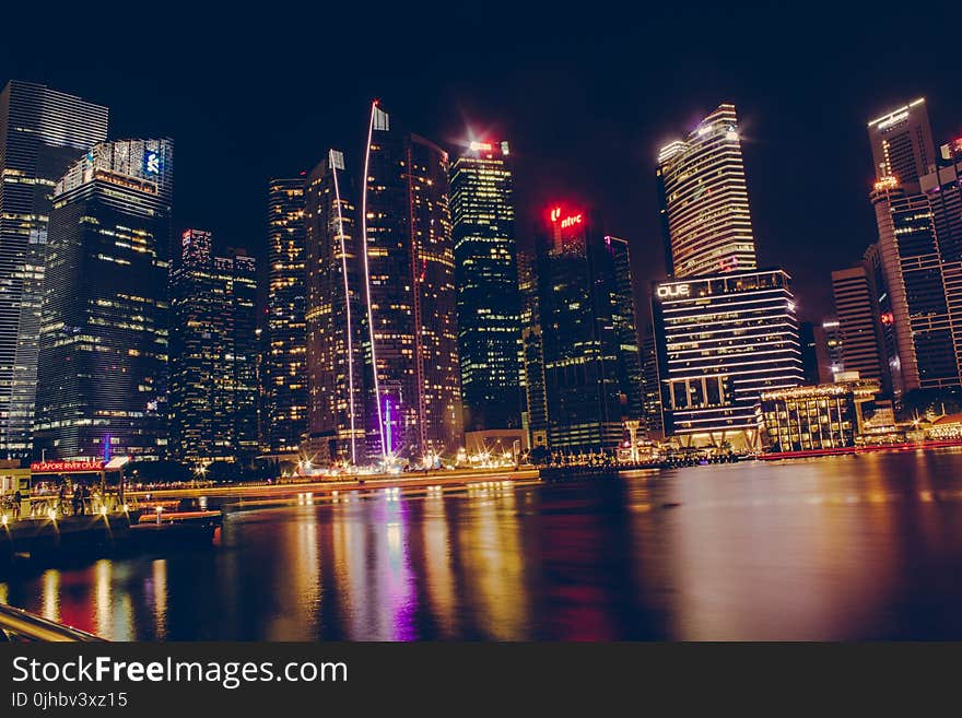 Photography Of High-Rise Building At Night Time