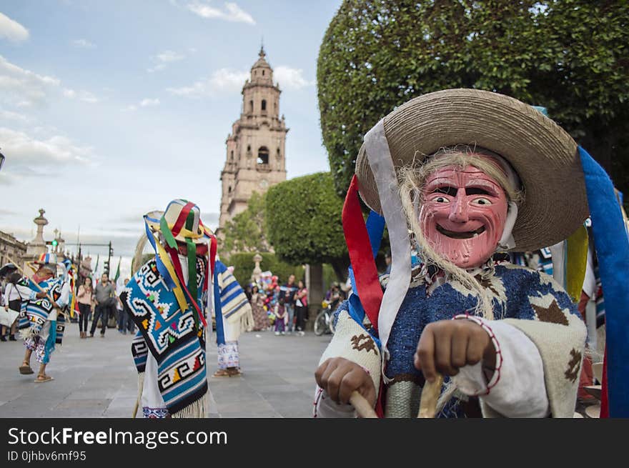 Person Wearing Blue and White Costume Taking Photo