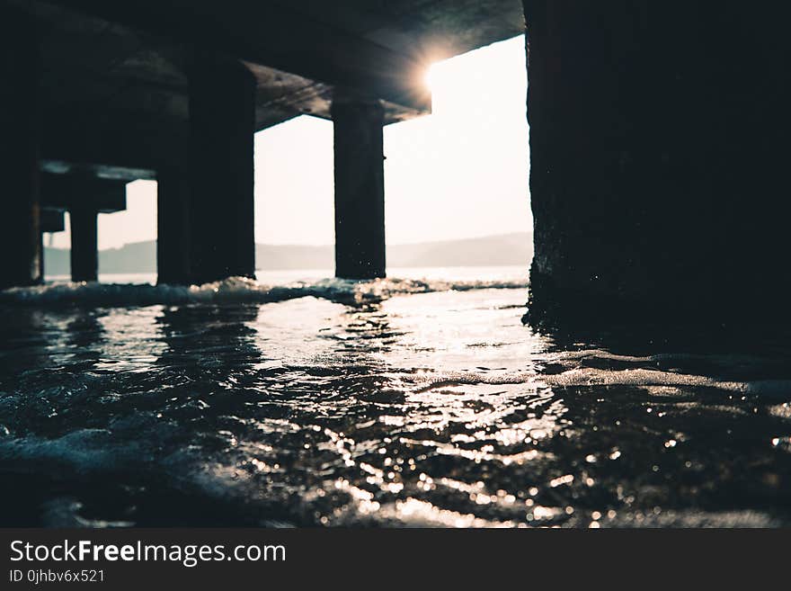 Photography of Sea Water Under The Dock