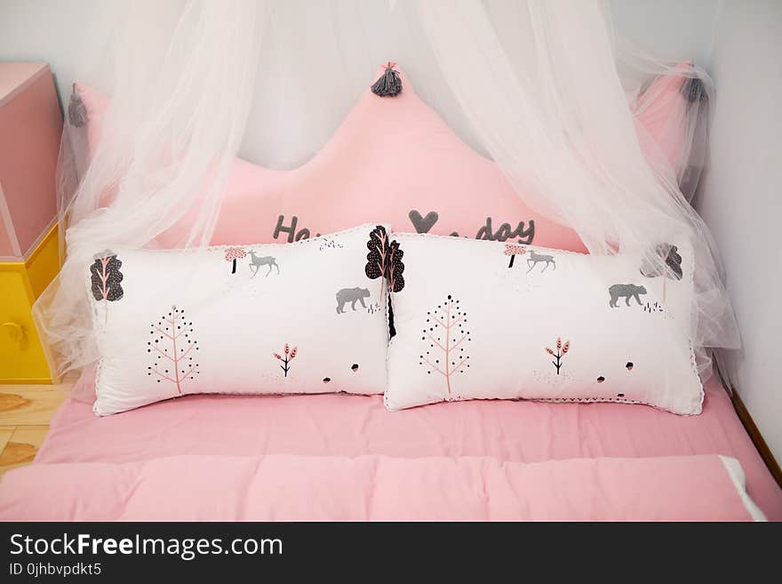 Photo of Two Pillows on the Bed