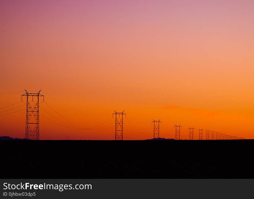 Photo of Electric Posts During Sunset